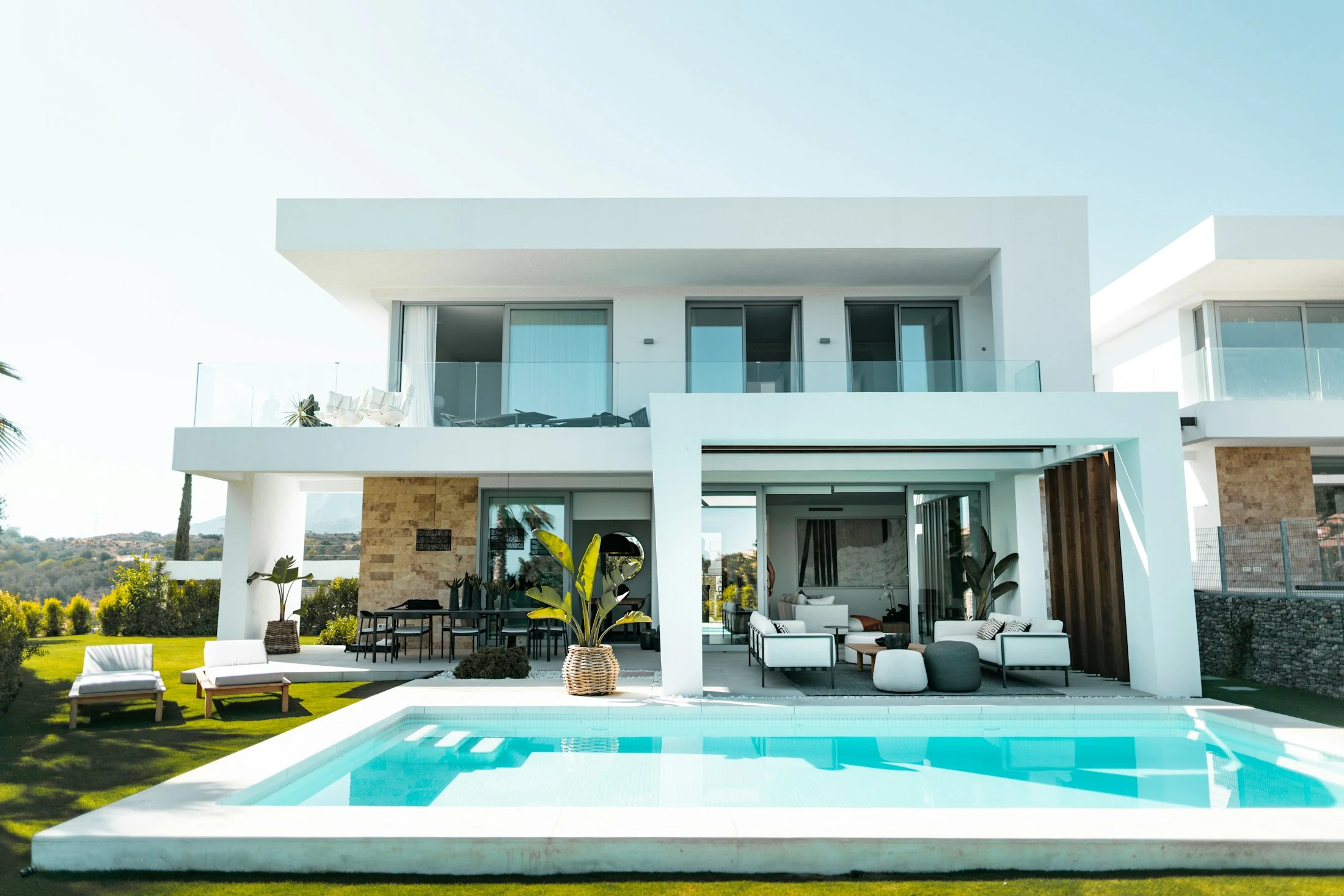 Bright contemporary two-storey house with a landscaped lawn and swimming pool